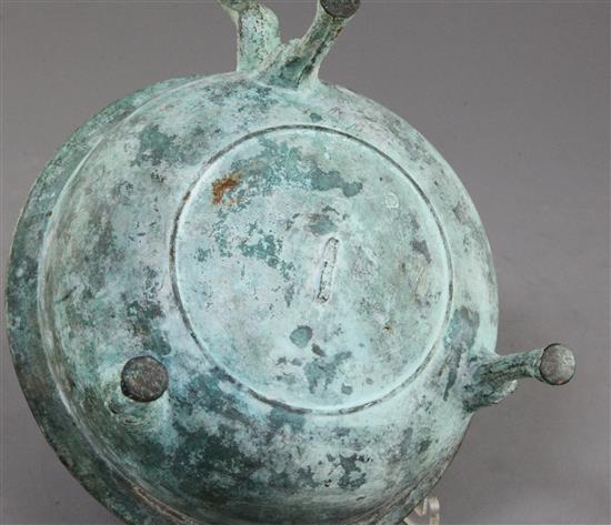 A Chinese archaic bronze tripod wine-warming vessel, Jiao Dou, Eastern Han dynasty, 1st-3rd century A.D., 13.5cm high, 32cm long